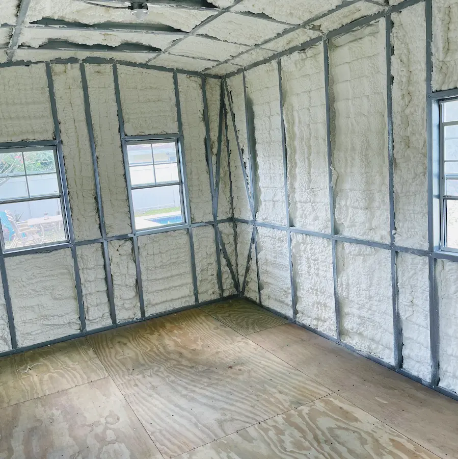 Closed-cell spray foam insulation applied to wall cavities in a residential project in Inwood
